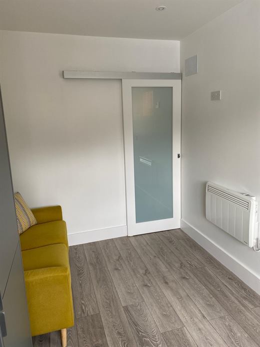 Bedroom with sliding frosted-glass door