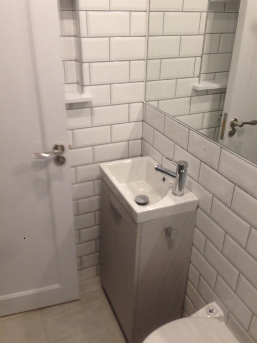 Compact vanity unit with metro tiled walls