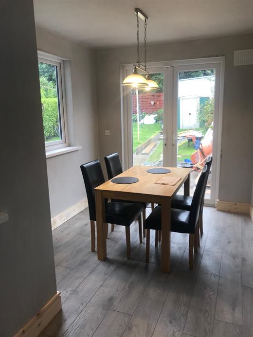 Dining room with grey walls and wood-effect flooring