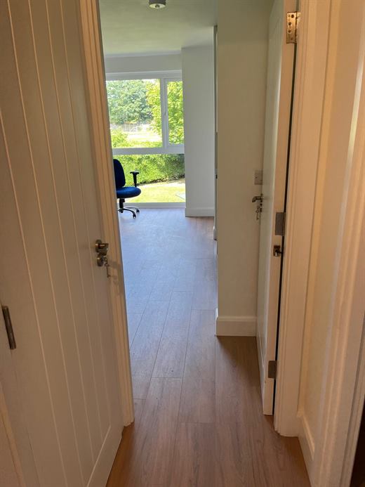 Hallway with new doors and laminate flooring