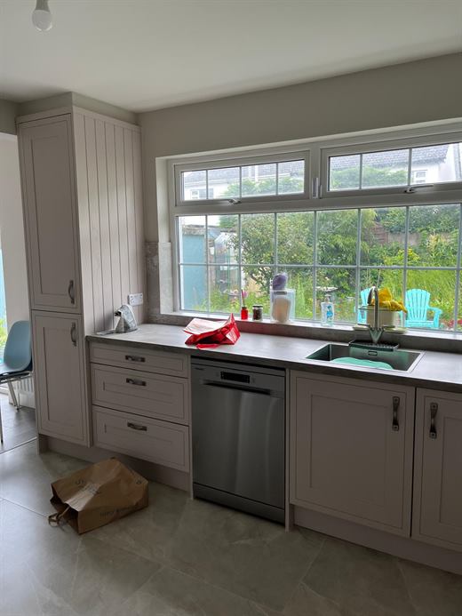 Kitchen with dishwasher and window over the sink