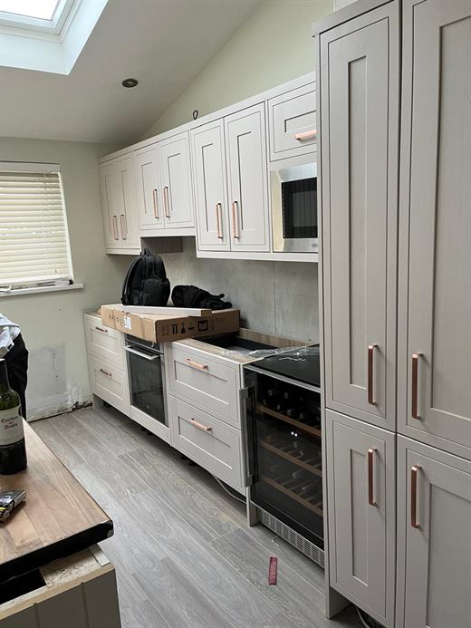 Kitchen with rooflight, built-in appliances and wine cooler