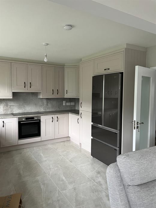 L-shaped kitchen with French-door fridge freezer