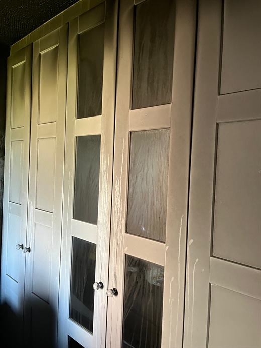 Traditional panelled wardrobe doors with glazed inserts