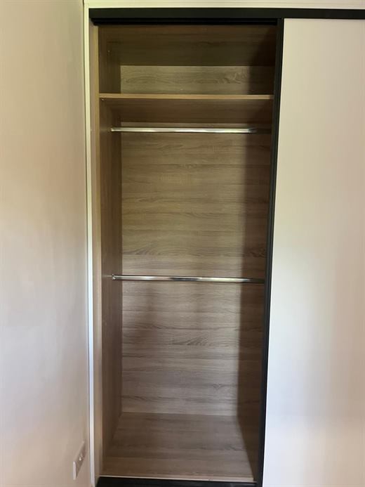 Wardrobe interior with shelving and hanging rail